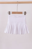 White pleated skort