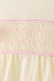 Cream smocked bow bubble