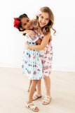 Fancy Flags Ruffle Cross Back Dress